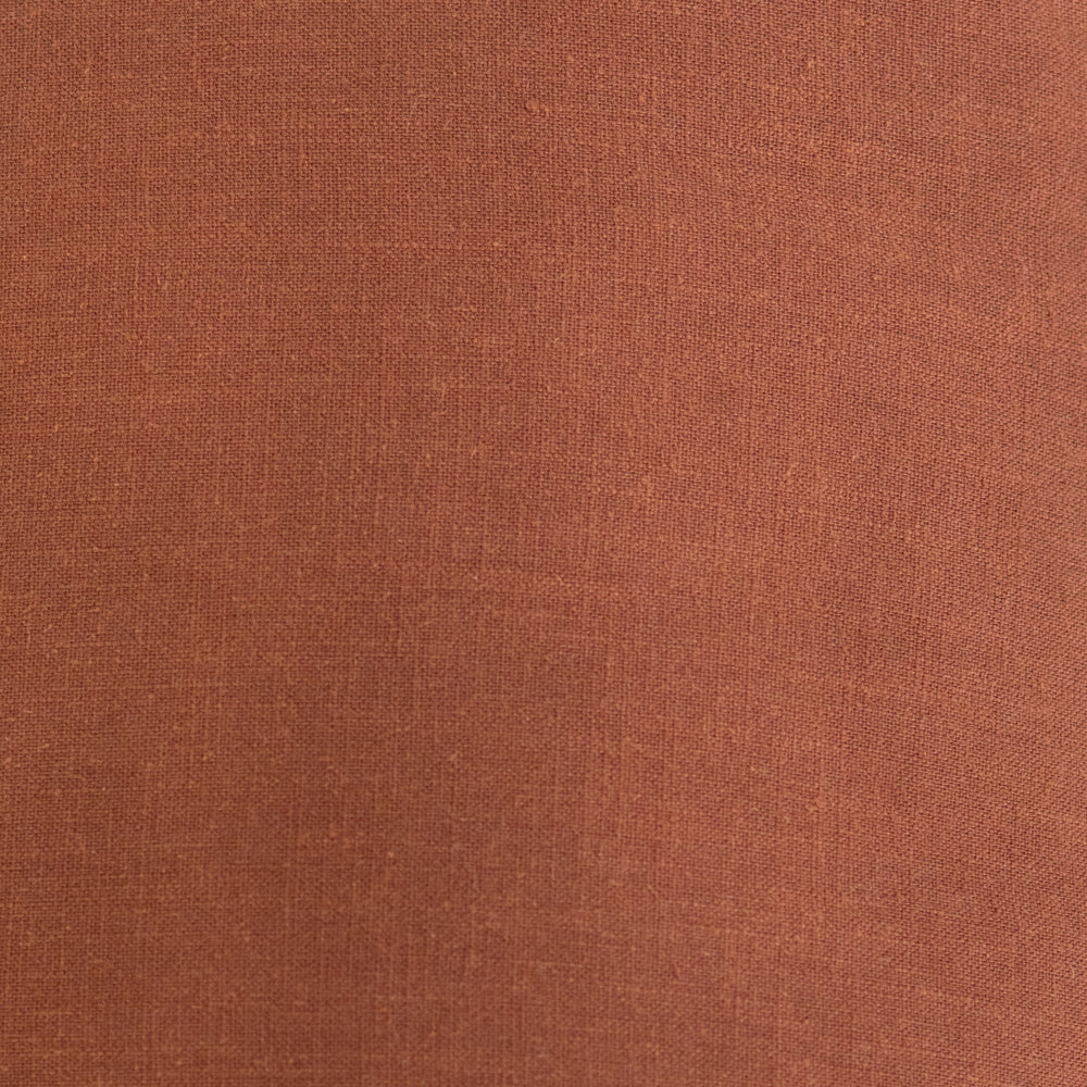 The Blair Terracotta Linen Cushion by Urban Road, measuring 50x50cm, features a simple rust-hued design with a subtle border—ideal for enhancing any home decor. Displayed on a white background.