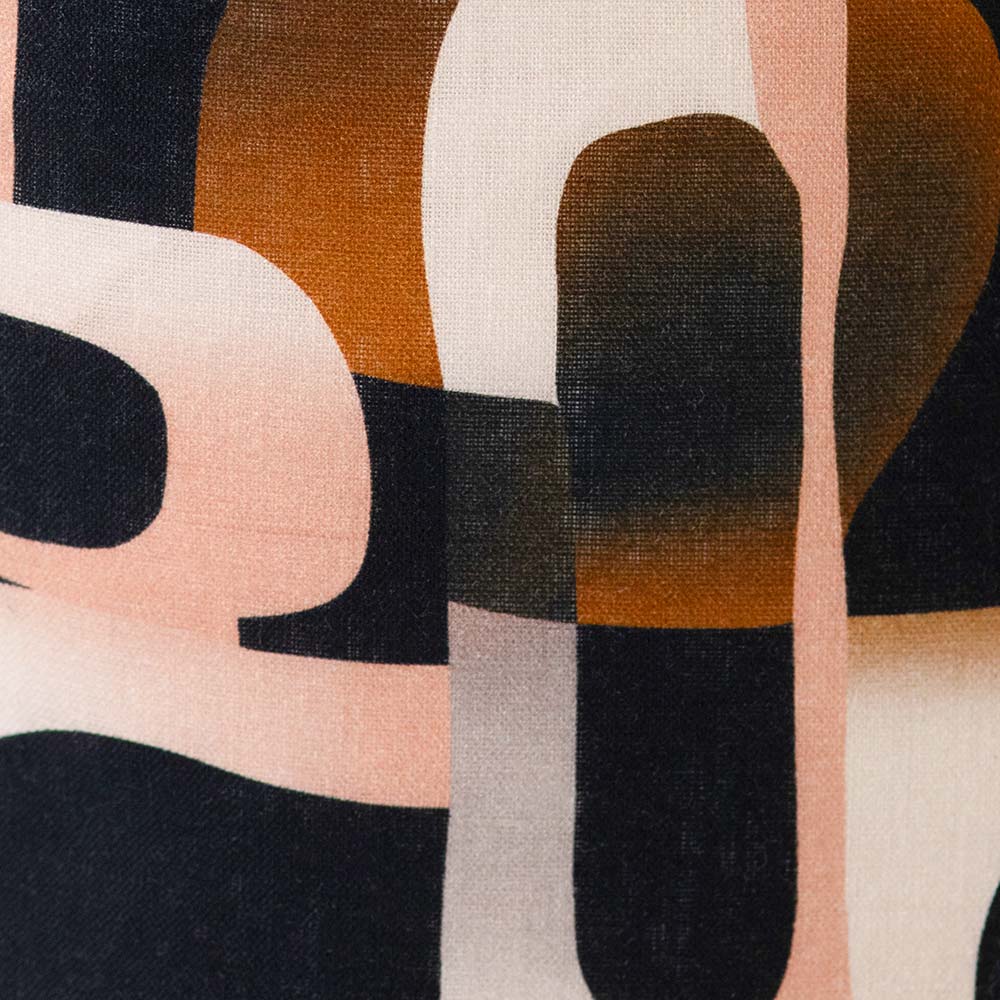 Cushion from the Tim Neve collection by Urban Road, showcasing bold black and brown abstract lines over a neutral base.