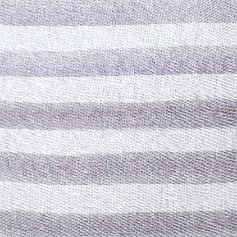 The Urban Road Rumi Striped Lilac Linen Cushion (50x50cm) features soft lilac and white stripes, a smooth linen texture, and a minimalist design—perfect for bringing understated elegance to your home decor.