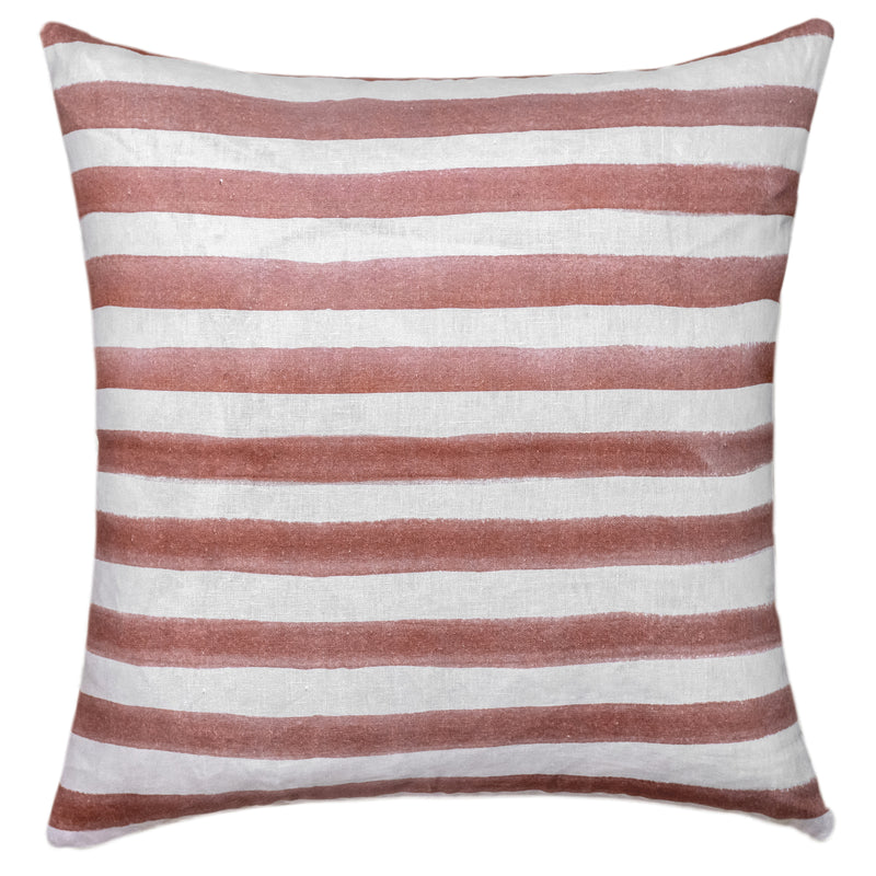The Rumi Striped Terracotta Linen Cushion With Feather Insert (50x50cm) by Urban Road features hand-painted, uneven reddish-brown stripes on white—ideal for adding a modern boho touch to your decor.