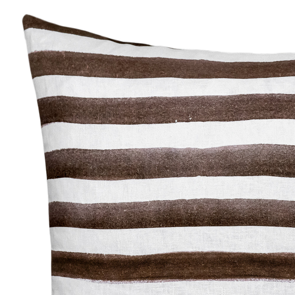 The Rumi Striped Chocolate Linen Cushion by Urban Road features horizontal brown and white stripes with a hand-painted effect, curved edges, and measures 50x50cm—a stylish accent for your home decor.