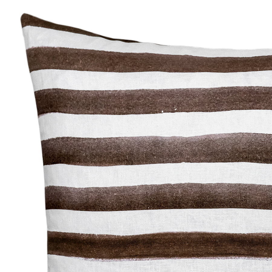 The Rumi Striped Chocolate Linen Cushion by Urban Road features horizontal brown and white stripes with a hand-painted effect, curved edges, and measures 50x50cm—a stylish accent for your home decor.