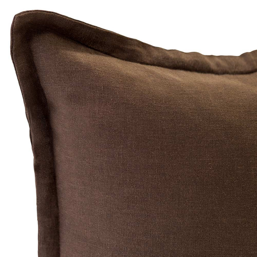 The Blair Chocolate Linen Cushion by Urban Road (50x50cm) features a simple design with a subtle border seam, adding tactile comfort and style to any space. Shown here in brown linen against a white background.