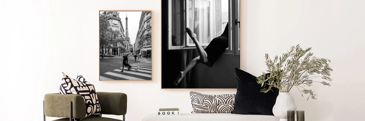 Modern interior showcasing striking black and white photography art, elegantly displayed above chic monochrome furnishings.