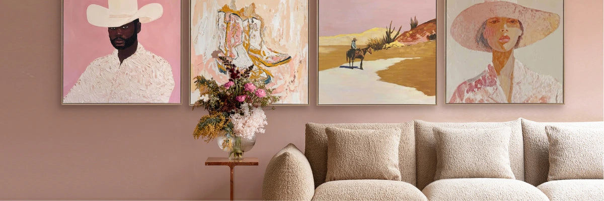 Soft and inviting living room featuring stylish pink-hued artwork, blending fashion illustrations and abstract paintings.