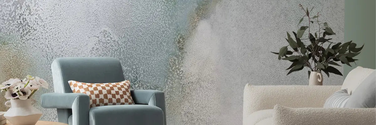 Stylish interior showcasing delicate watercolour-inspired wallpaper in soft pastel and neutral tones, creating a calming vibe.