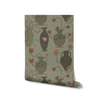 Sage green wallpaper with tonal vases and muted terracotta florals, featuring meandering dark stems, from the Shatha collection with Urban Road.