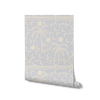 Playful sky blue wallpaper with cream palm trees and crescent moon motifs, bordered with a woven stripe detail, from the Shatha collection with Urban Road.