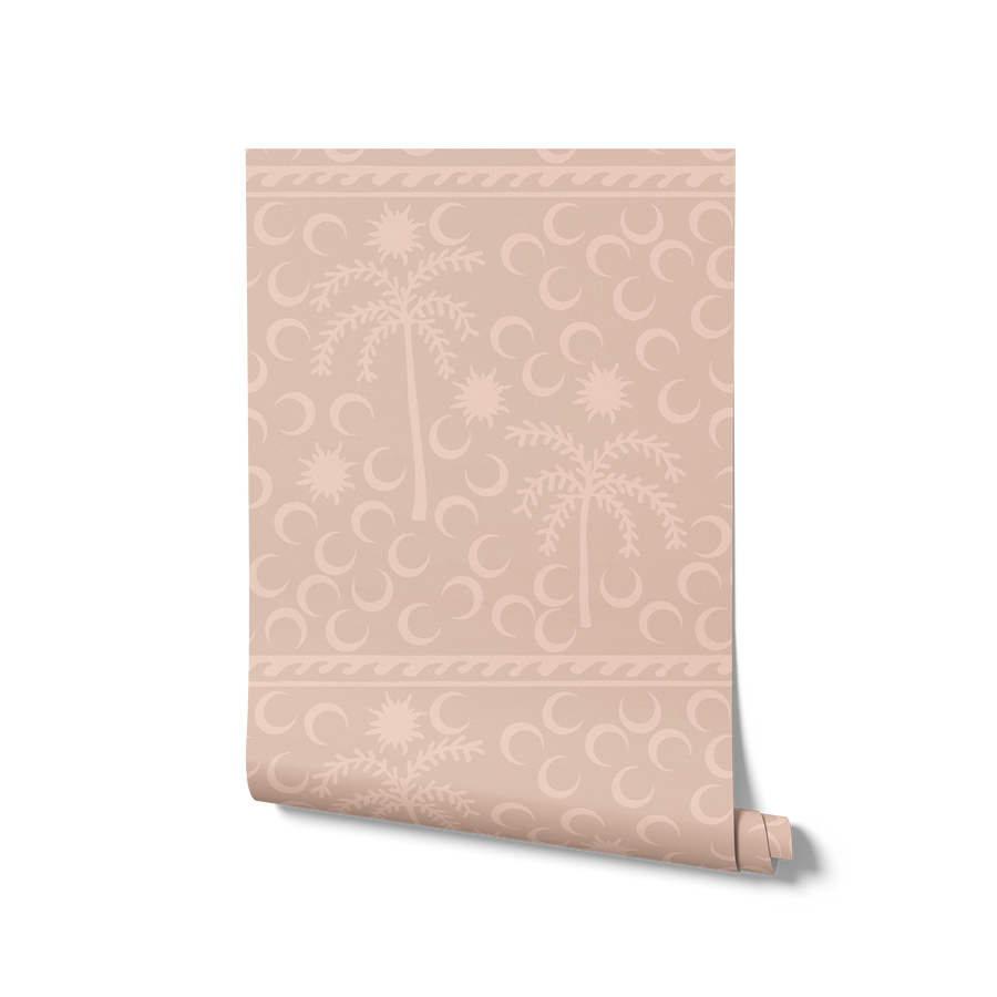 Muted sage wallpaper with understated palm trees and crescent moons in tonal greys, framed by a top border, from the Shatha collection with Urban Road.