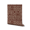 Rich dark brown wallpaper with chocolate palm silhouettes and moon patterns, topped with a subtle striped border, from the Shatha collection with Urban Road.