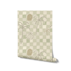 Soft sage green wallpaper with hand-drawn checkered squares, stylised palm trees, a face motif, and a shell illustration, from the Shatha collection with Urban Road.