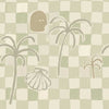 Soft sage green wallpaper with hand-drawn checkered squares, stylised palm trees, a face motif, and a shell illustration, from the Shatha collection with Urban Road.