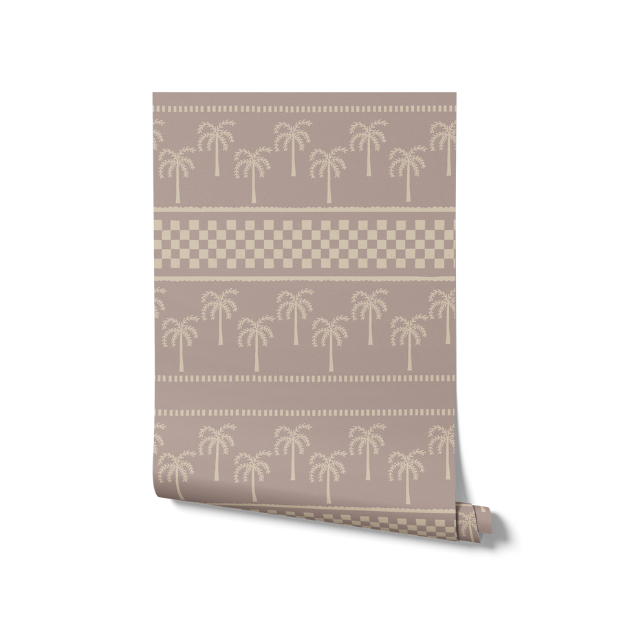 Clay-toned wallpaper featuring hand-drawn palm trees in horizontal rows, bordered with dotted and checkered bands, from the Shatha collection with Urban Road.