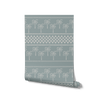 Cool blue wallpaper with rows of pale palms and decorative bands in soft ivory and light blue, from the Shatha collection with Urban Road.