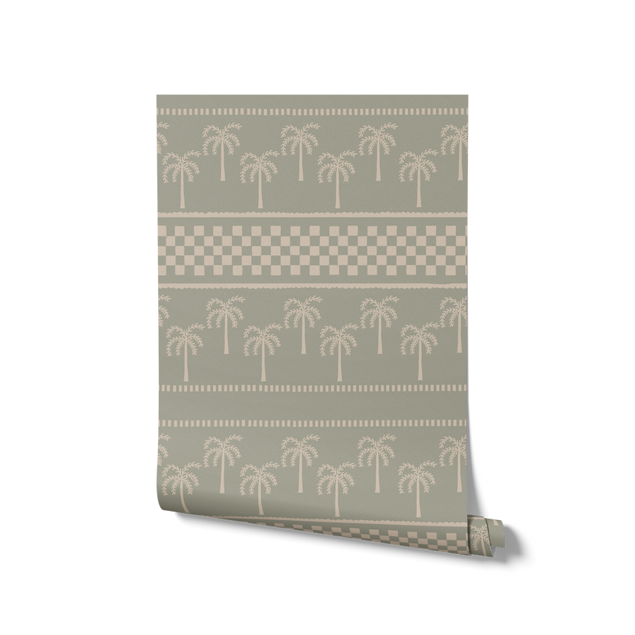 Sage green wallpaper with minimalist palm motifs and alternating checkered and striped bands, from the Shatha collection with Urban Road.