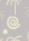 Soft sky blue wallpaper with cream-toned tropical illustrations of palms, moons, and spiral suns, from the Shatha collection with Urban Road.