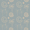 Muted blue wallpaper featuring whimsical line-drawn palms, celestial shapes, and spiralling motifs in ivory, from the Shatha collection with Urban Road.