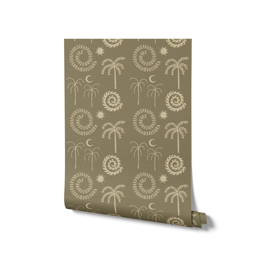 Purple blush wallpaper with soft pink undertones and cream palm motifs, crescent moons, and spiralling sunbursts, from the Shatha collection with Urban Road.