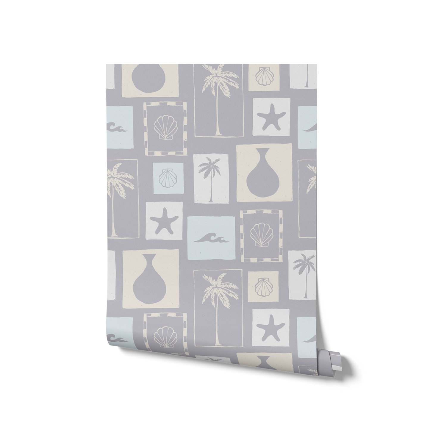 Light blue wallpaper with soft cream coastal illustrations in a patchwork of framed motifs including palms, seashells, and waves, from the Shatha collection with Urban Road.