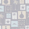 Light blue wallpaper with soft cream coastal illustrations in a patchwork of framed motifs including palms, seashells, and waves, from the Shatha collection with Urban Road.