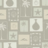 Soft sage wallpaper with cream-toned framed tropical imagery—palm silhouettes, shells, and abstract coastal elements, from the Shatha collection with Urban Road.