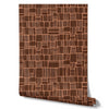 Wallpaper from the Tim Neve collection by Urban Road, with deep brown grid lines on a soft ochre backdrop, blending warmth and modern texture.