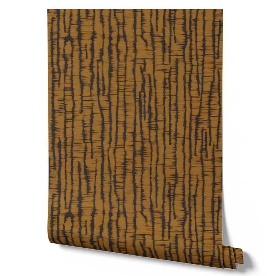 Wallpaper from the Tim Neve collection by Urban Road, combining black bark patterns with golden accents for a striking, modern contrast.