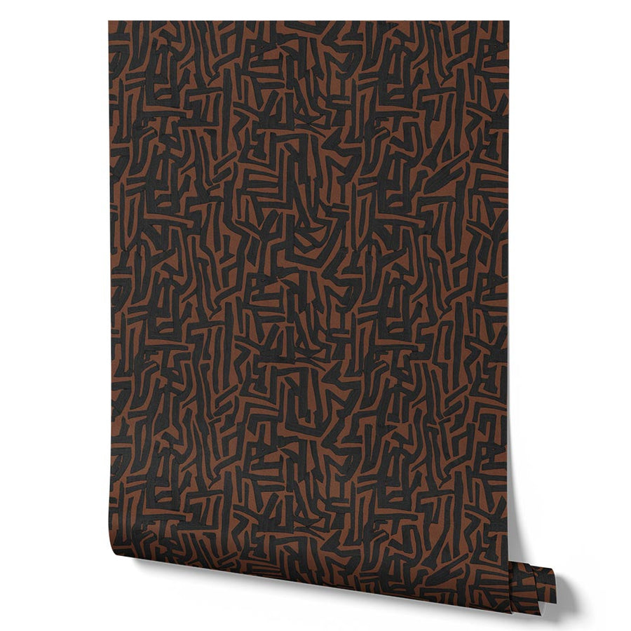 Wallpaper from the Tim Neve collection by Urban Road, featuring bold black maze-like patterns on a warm brown background.