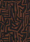 Wallpaper from the Tim Neve collection by Urban Road, featuring bold black maze-like patterns on a warm brown background.