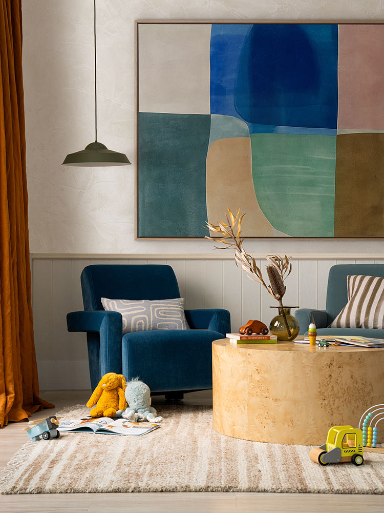 Sun Tiles II geometric abstract artwork styled in a warm-toned living room with velvet chairs and round timber table.