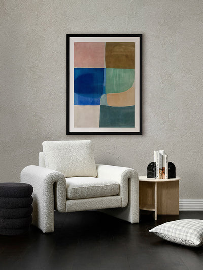 Sun Tiles II geometric abstract artwork styled in a warm-toned living room with velvet chairs and round timber table.
