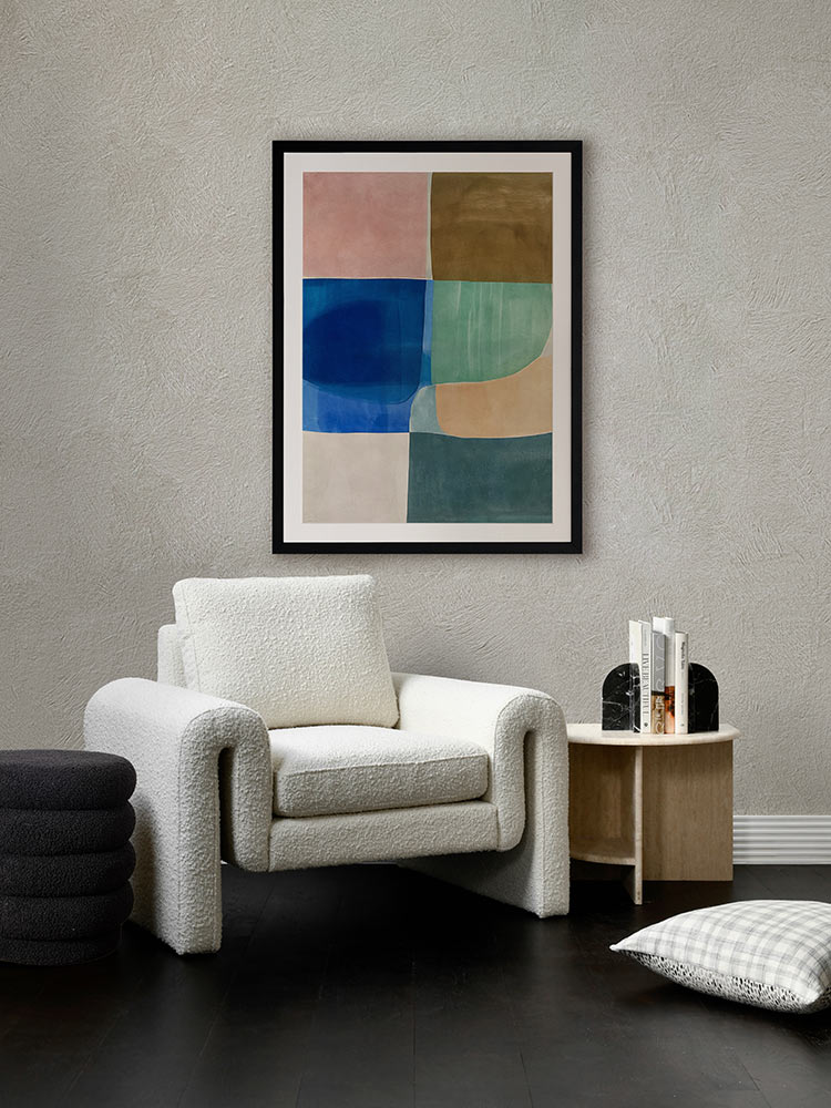 Sun Tiles II geometric abstract artwork styled in a warm-toned living room with velvet chairs and round timber table.