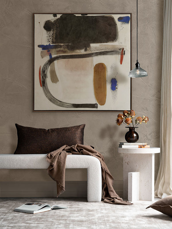 Homebound I expressive abstract art print featured above a bed in a warm, minimal bedroom with rich brown textiles.
