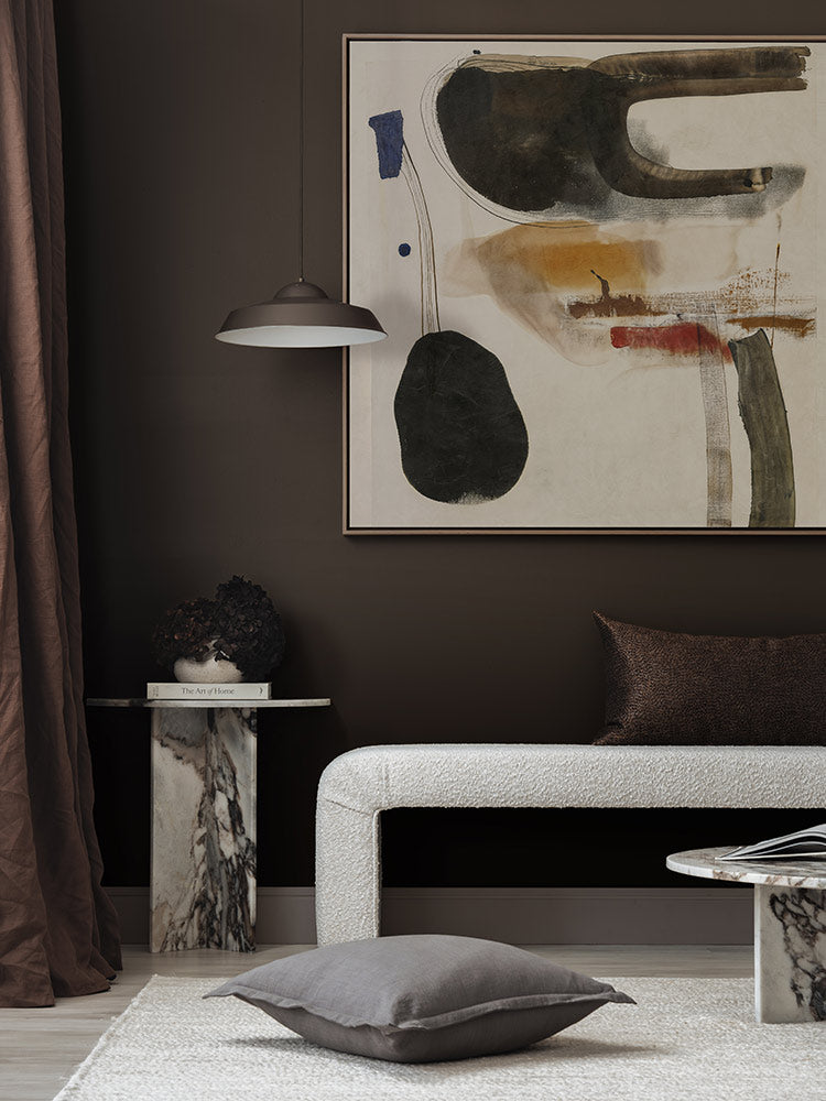 Homebound II artwork styled in a contemporary bedroom with dark brown drapes, monochrome furniture and layered cushions.