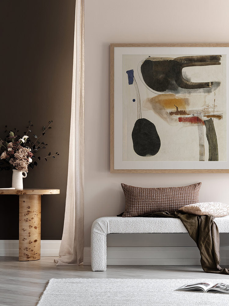 Homebound II artwork styled in a contemporary bedroom with dark brown drapes, monochrome furniture and layered cushions.