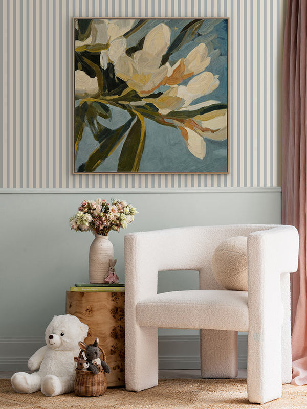 Flowering Hour I floral artwork styled above a soft white chair with a striped wall, styled with flowers and curved decor.