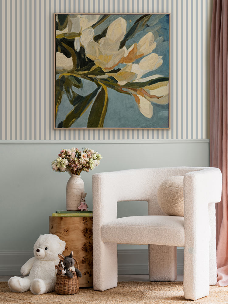 Flowering Hour I floral artwork styled above a soft white chair with a striped wall, styled with flowers and curved decor.