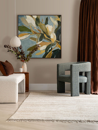 Flowering Hour II botanical art print styled in a warm space with soft green and neutral furniture and timber accents.