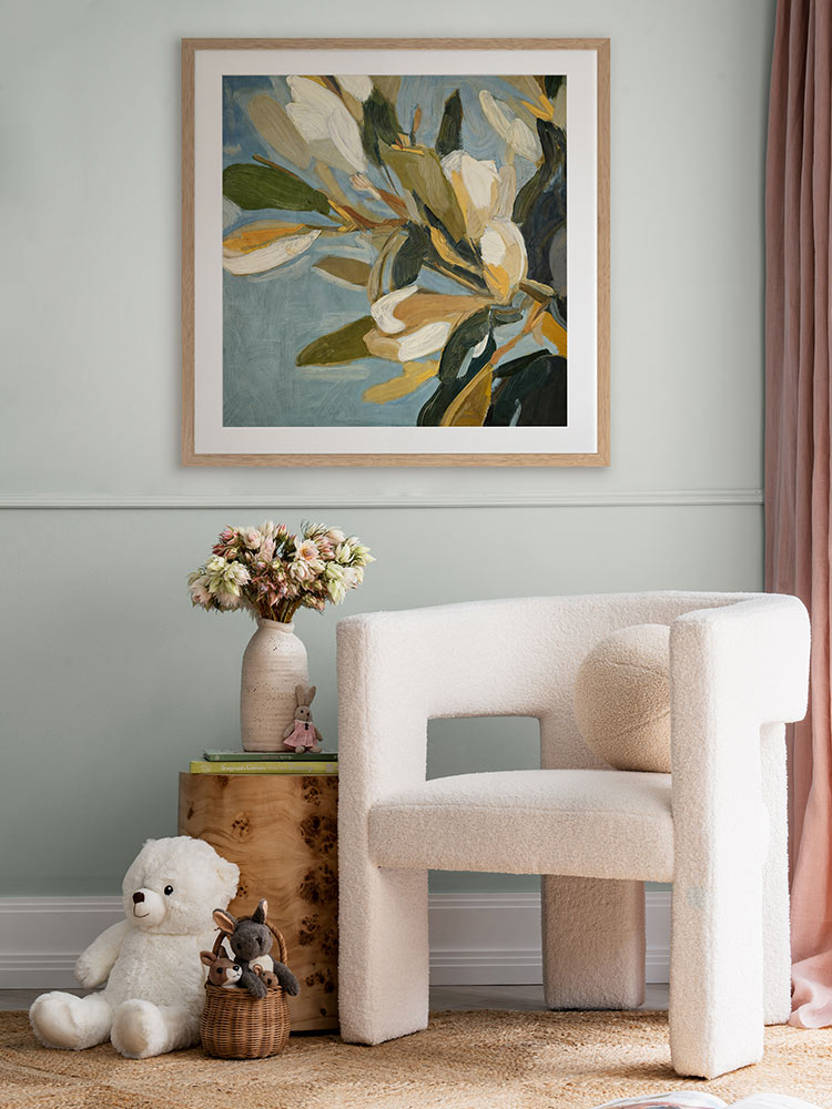 Flowering Hour II botanical art print styled in a warm space with soft green and neutral furniture and timber accents.