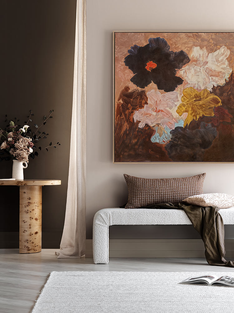 Floral Afterglow flower art print styled with a warm brown wall, neutral furniture and soft rug in a modern living room.