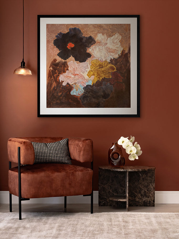 Floral Afterglow flower art print styled with a warm brown wall, neutral furniture and soft rug in a modern living room.