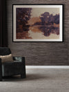 Sunset at Lavender Lake I landscape art print hangs above a grey chair in a neutral room with floral decor and moody drapery.