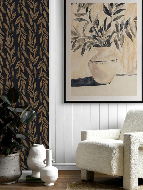 Golden Vase botanical artwork styled above a beige armchair in a caramel-toned living space with a grey rug and soft drapery.