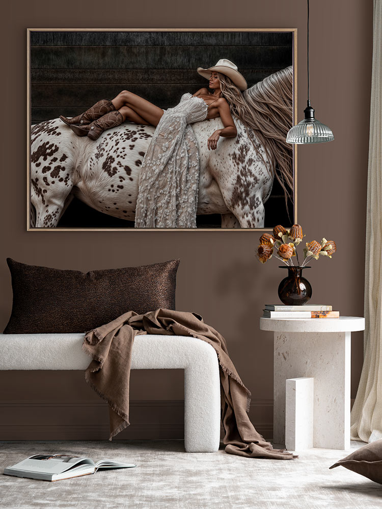 Horses Are a Girl’s Best Friend art print above neutral decor in a rich, chocolate-toned room with soft linens and florals.