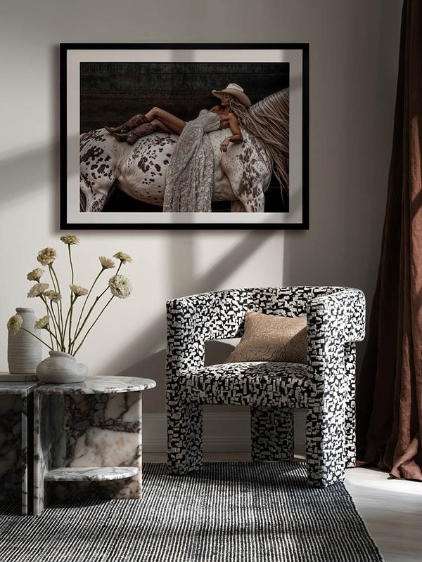 Horses Are a Girl’s Best Friend art print above neutral decor in a rich, chocolate-toned room with soft linens and florals.