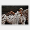 Glamorous photographic horse wall art featuring a woman in a cowboy hat and boots relaxing on a horse in earthy tones.