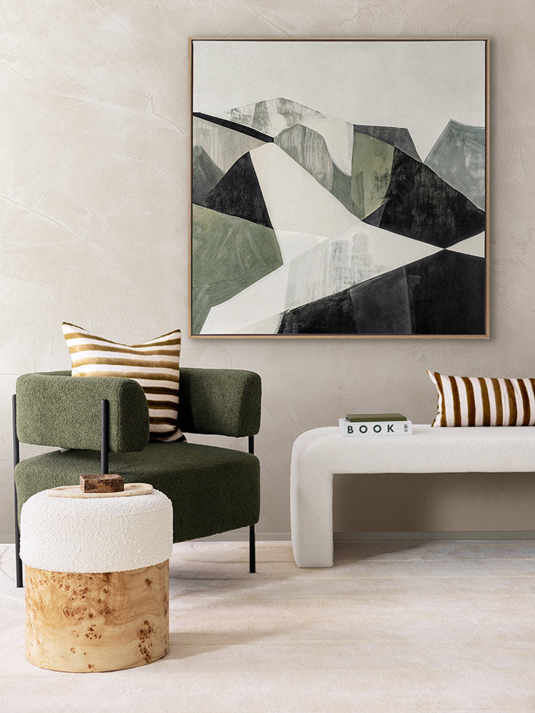 Geometric Landscape I abstract art print in a bright room with a white love seat, striped cushions, and olive green armchair.