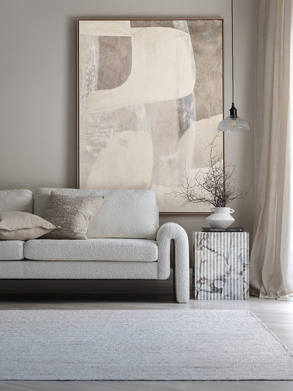 Nostalgic Mood I abstract art print above a white sofa with light walls, white rug, and soft neutral styling.