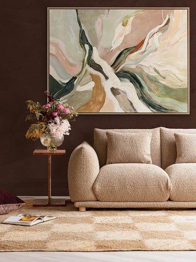 Warm Memories II abstract art print in a warm room with peach boucle sofa, retro rug and florals for a cosy, inviting feel.