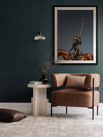 She’s a Polo Player portrait art hanging in a modern lounge with beige armchairs, white curtains and a sculptural side table.